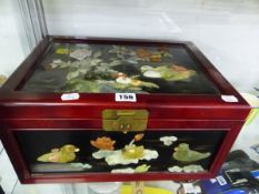 A CHINESE LACQUER BOX INLAID WITH SEMI PRECIOUS STONE FLOWERS AND BIRDS.