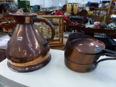 A LARGE ANTIQUE COPPER MEASURE JUG, AND TWO COPPER SAUCEPANS.