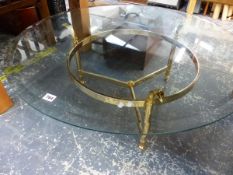 A BRASS BASED GLASS TOPPED COFFEE TABLE.