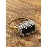 A 9ct GOLD AND CZ MULTI CLUSTER RING IN A CLAW SETTING. FINGER SIZE N, WEIGHT 2.82grms.