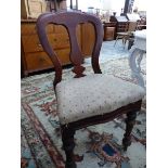 A SET OF FOUR VICTORIAN BALLOON BACK DINING CHAIRS.