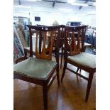 A SET OF FOUR MID CENTURY TEAK SIDE CHAIRS.