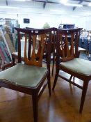 A SET OF FOUR MID CENTURY TEAK SIDE CHAIRS.