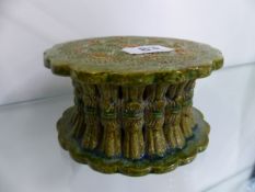 AN INTERESTING ORIENTAL GREEN GLAZED POTTERY STAND.