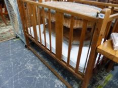 A VINTAGE WALNUT FRAMED FOLDING COT.