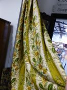 A PAIR OF LARGE LONG INTERLINED FLORAL PATTERNED CURTAINS.