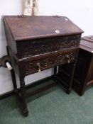 A 17th C. AND LATER OAK BIBLE BOX ON STAND.