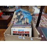 A QUANTITY OF VINTAGE RECORD ALBUMS INCLUDING BEACH BOYS, ROD STEWART, CHUCK BERRY, AND OTHERS.