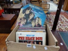 A QUANTITY OF VINTAGE RECORD ALBUMS INCLUDING BEACH BOYS, ROD STEWART, CHUCK BERRY, AND OTHERS.