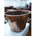 AN ANTIQUE COPPER TWO HANDLED BUCKET.