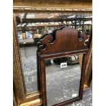 A GEORGIAN WALNUT FRET CUT SMALL MIRROR, TOGETHER WITH ANOTHER INLAID MAHOGANY MIRROR AND A LATER