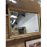 A DECORATIVE GILT BEVEL EDGE MIRROR 68 x 100cms