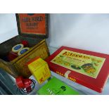 A TIN BOX OF MECCANO WHEELS AND OTHER ITEMS, MECCANO GEARS, EMEBO MOTOR, ETC.