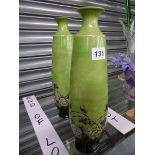 A PAIR OF GREEN GROUND DOULTON STONE WARE VASES DESIGNED BY ELIZA SIMMANCE. H 33cms.