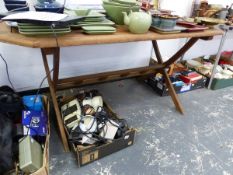 A TEAK GARDEN TABLE.