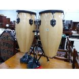 A PAIR OF TOCA HAND PERCUSSION BONGOS ON STAND WITH A DVD INSTRUCTION MANUAL.