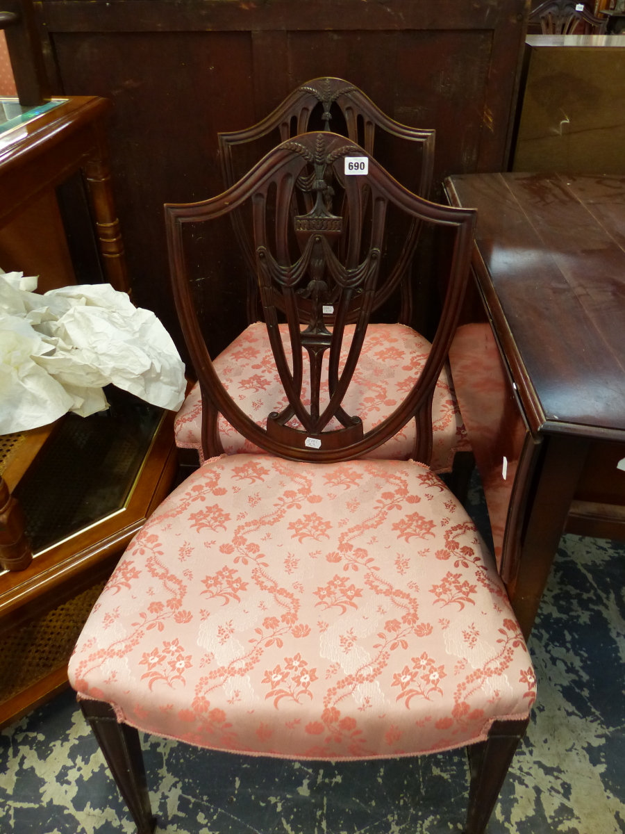 A PAIR OF SHIELD BACK DINING CHAIRS AND A RUSH SEAT CHAIR.