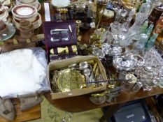 A COLLECTION OF VARIOUS SILVER PLATED WARES, CUTLERY, BRASS CANDLESTICKS, A VANITY CASE, SCALES ETC.