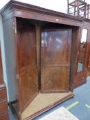 A GEORGE III MAHOGANY TWO DRAWER WARDROBE.