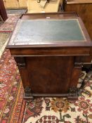 A 19th C. MAHOGANY DAVENPORT DESK WITH FOUR DRAWERS TO ONE SIDE OF THE LEATHER INSET TOP
