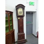 AN EARLY 19th C. MAHOGANY CASED 8 DAY LONG CASE CLOCK WITH ARCHED BRASS DIAL.