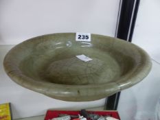 AN ORIENTAL CELEDON SHALLOW BOWL WITH CRAKLE GLAZE