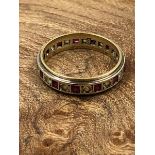 A VINTAGE GARNET AND CZ FULL ETERNITY RING, STAMPED 9ct AND ASSESSED AS 9ct GOLD. FINGER SIZE R.