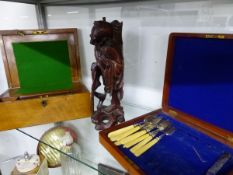 A MAHOGANY CASE OF FISH KNIVES AND FORKS, A WRITING SLOPE AND A CHINESE HARD WOOD FIGURE
