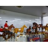 A COLLECTION OF BESWICK HORSES TOGETHER WITH OTHERS AND HUNTING FIGURES MARKED FOREIGN