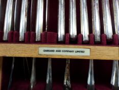 A GARRARDS CANTEEN OF EIGHT PLACE SETTINGS OF ELECTROPLATE CUTLERY