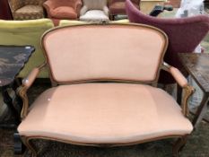 A 20th C. STAINED WOOD SHOW FRAME TWO SEAT SETTEE UPHOLSTERED IN PINK VELVET. W 116cms