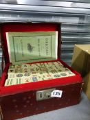 A LEATHER CASED MAHJONG SET