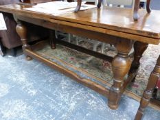 AN 17th. C STYLE OAK DRAW LEAF REFECTORY TYPE TABLE