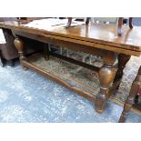 AN 17th. C STYLE OAK DRAW LEAF REFECTORY TYPE TABLE