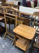 AN ERCOL TABLE WITH SINGLE DRAWER AND A TIER JOINING THE LEGS TOGETHER WITH A PINE CLOTHES STAND