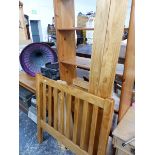 A PINE SINGLE BED, A BOOKCASE AND A DRESSING TABLE.