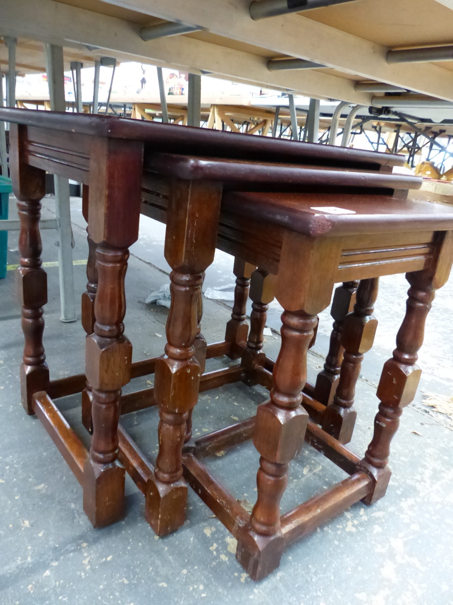 AN OAK NEST OF TABLES.