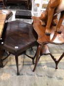 AN EDWARDIAN MAHOGANY HEXAGONAL TABLE TOGETHER WITH A MAHOGANY SERPENTINE EDGED TABLE, BOTH WITH