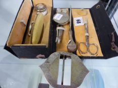 A CASED TRAVELLING SILVER HALLMARKED MANICURE SET, TOGETHER WITH A SILVER HALLMARKED BELT BUCKLE,