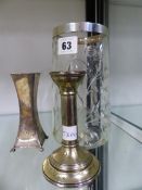A HALLMARKED SILVER RIMMED CUT GLASS VASE, A SMALL SILVER CANDLE STICK AND A SQUARE FORM BUD VASE.