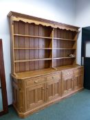 A VERY LARGE BESPOKE PINE DRESSER AND PLATE RACK.