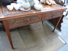 A ANTIQUE CARVED MAHOGANY HALL TABLE WITH TWO DRAWERS.