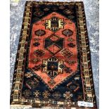 A PERSIAN TRIBAL RUG 181 x 108 cms