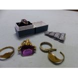 AN ANTIQUE GOLD PLATED SPINNING FOB, A SILVER AND AMETHYST FILIGREE RING, A 9ct GOLD SIGNET RING AND