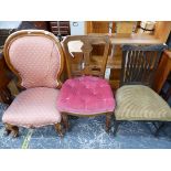 A VICTORIAN NURSING CHAIR AND TWO SIDE CHAIRS.