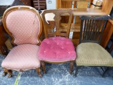 A VICTORIAN NURSING CHAIR AND TWO SIDE CHAIRS.