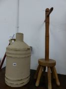 A LARGE PAINTED BRASS FUEL CAN TOGETHER WITH A VINTAGE WASH DOLLY.