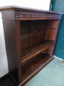 A LATE VICTORIAN OAK OPEN FRONT BOOKCASE WITH ADJUSTABLE SHELVES.