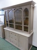 AN ANTIQUE PAINTED PINE GLAZED TOP DRESSER.