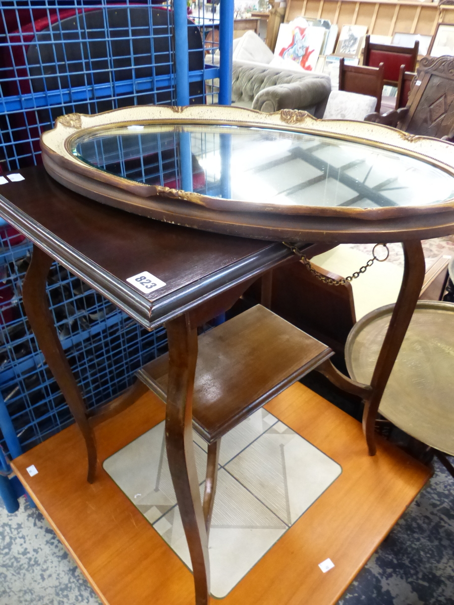 A MAHOGANY OCCASIONAL TABLE AND AN OVAL MIRROR.
